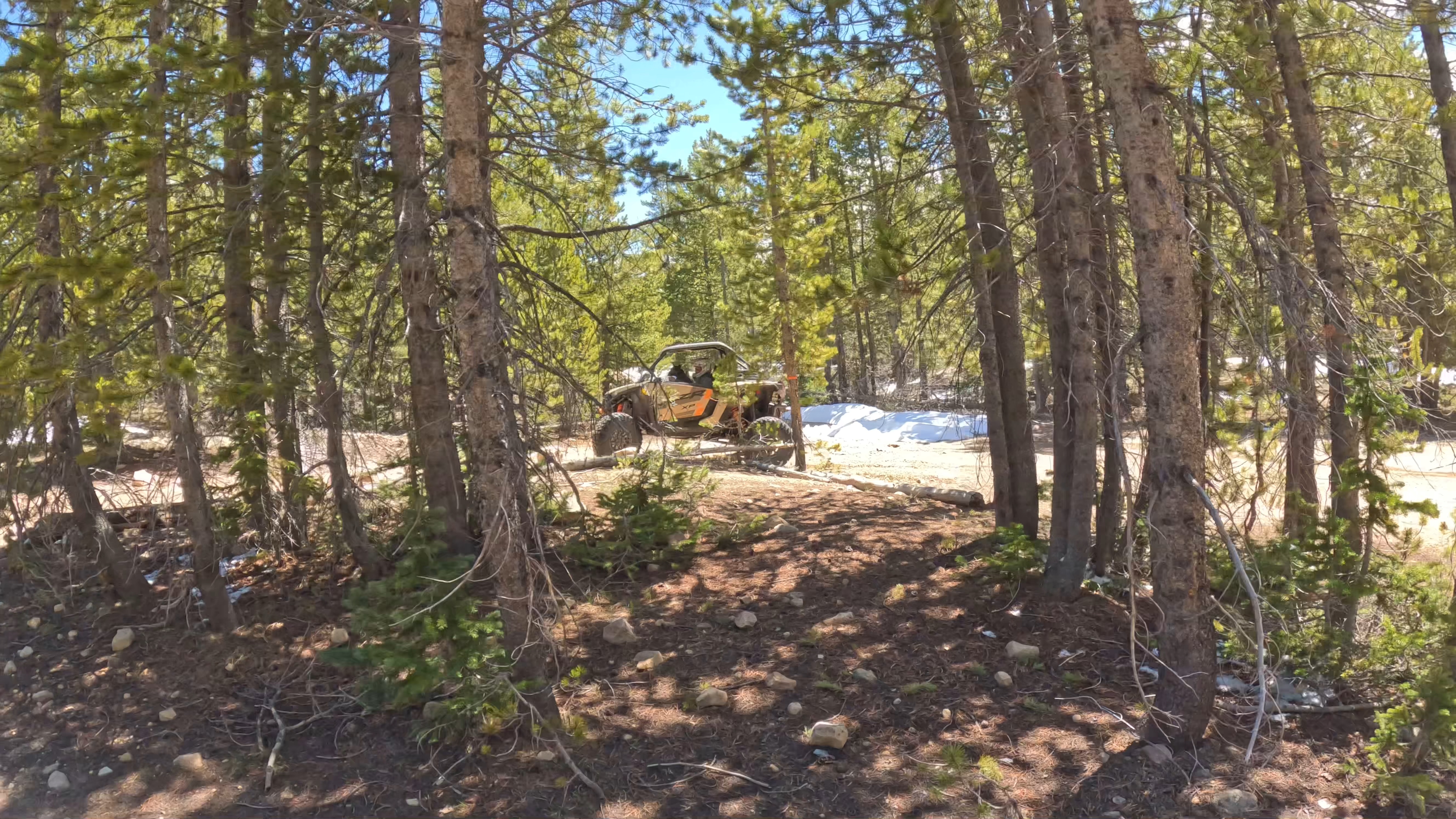 A small group of members riding together through high desert